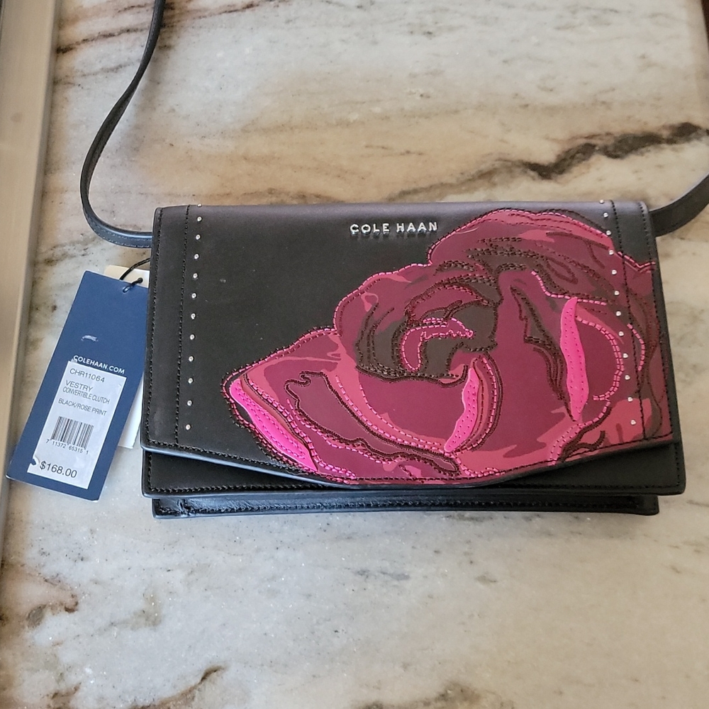 Beautiful Cole Haan convertible cluch Black/Rose Print.  One pocket inside/outsi
